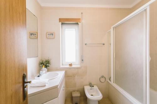 a bathroom with a sink and a toilet and a shower at Best Houses 84 - Mar Salgado in Ferrel