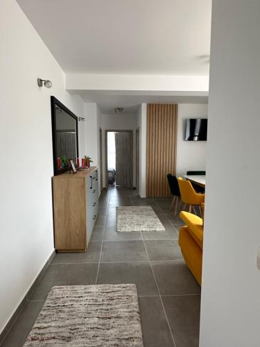 a living room with a couch and a table at Apartamente Ariniș in Gura Humorului