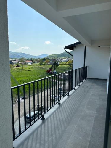 a balcony with a view of a field at Apartamente Ariniș in Gura Humorului