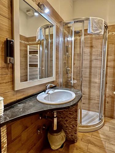 a bathroom with a sink and a shower at Casa Zeffirino in Sanremo