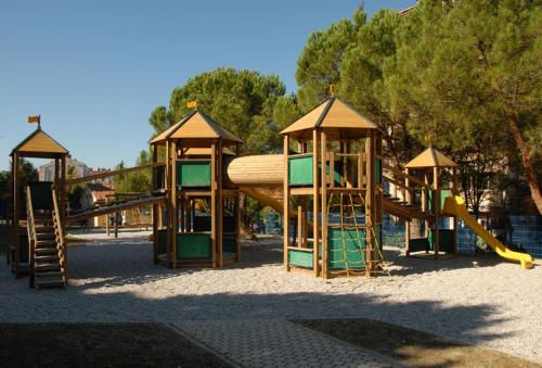 a playground with a slide in a park at Villa Dolce Amaro in Izola