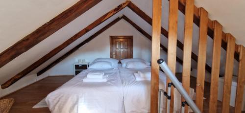 a bedroom with a bed in the attic at Studio apartman Tomi - seaview in Vis