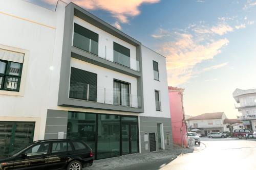 a black car parked in front of a building at Gold Apartment Ferrel II in Ferrel