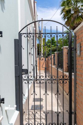 an entrance to a house with an iron gate at Villa Gina Case Vacanze in Roseto degli Abruzzi