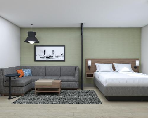 1 dormitorio con 1 cama y 1 sofá en Hyatt Place Sacramento International Airport en Sacramento