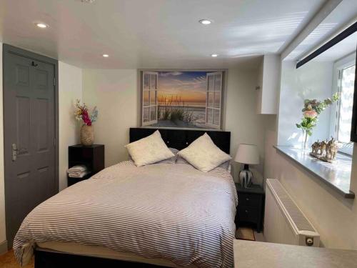a bedroom with a bed and a window at Lux Double Bed Studio by town & beach in Ryde