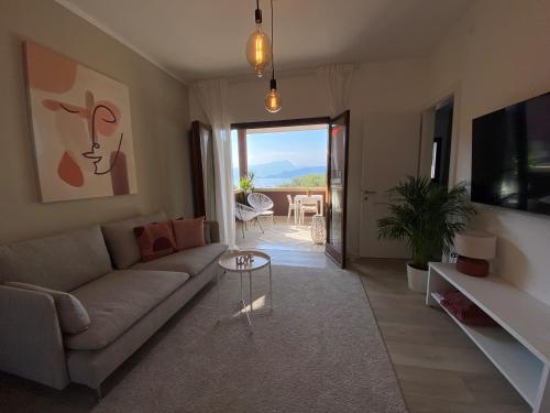 a living room with a couch and a table at Boutiqueloft Vista in Bardolino