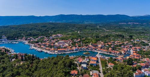an aerial view of a small town next to a river at Studio Apartment Stela in Vrboska