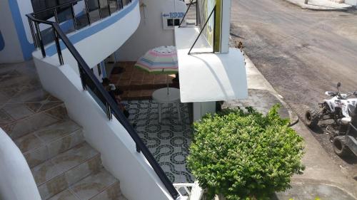 an overhead view of a stairway with a house at Hostal Cerro Azul in Puerto Villamil