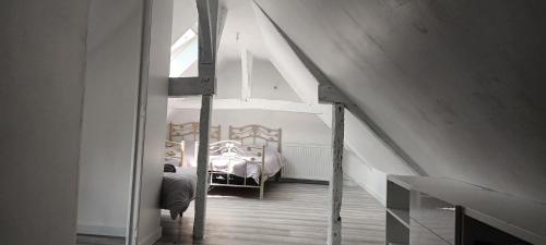 En eller flere senge i et værelse på Maison de campagne