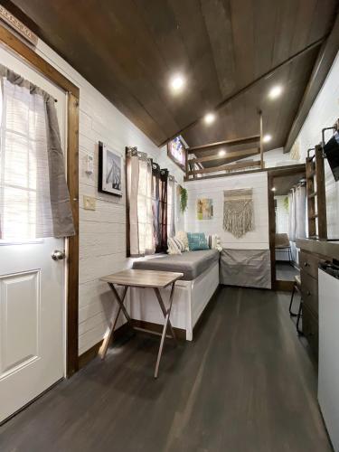 a room with a bed and a table in a trailer at Tiny House Leadville Colorado in Leadville