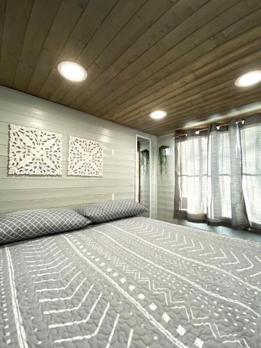 a bedroom with a large bed in a room at Tiny House Leadville Colorado in Leadville