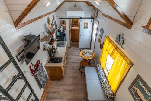 an overhead view of a kitchen and living room in a tiny house at Tiny House Leadville Colorado in Leadville