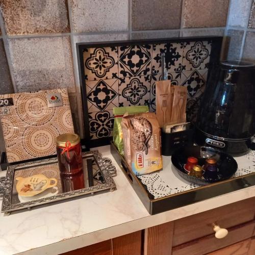 a counter with two trays of food on it at Casa da Sogno Elegant Studio in Nafpaktos