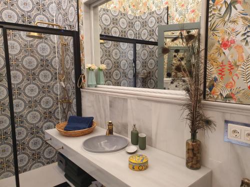 a bathroom with a sink and a window at Apartamento Jema El Bajondillo in Torremolinos