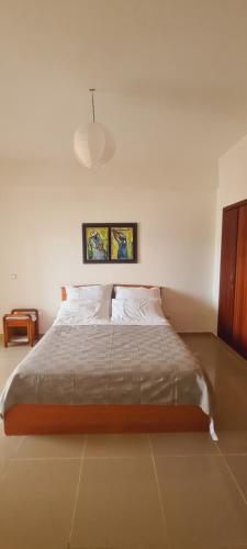 Un pat sau paturi într-o cameră la Residence AL Massira CGI Fnideq plage