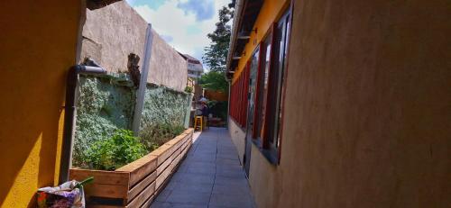 a narrow alleyway between two buildings next to a building at YASI Hostel in Lyon