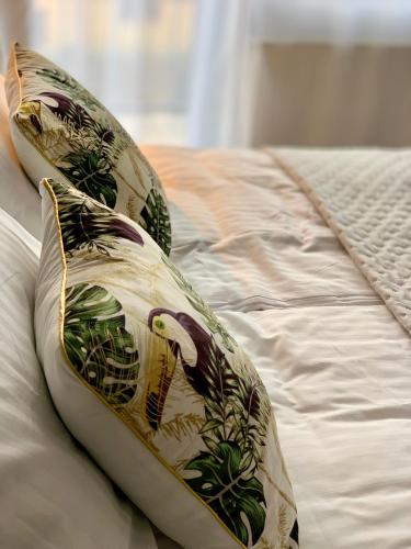 a pillow sitting on top of a bed at WiLLA APART in Władysławowo
