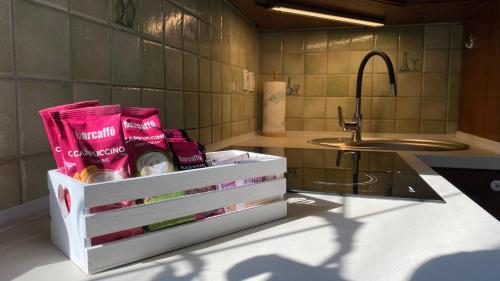 a white box on a counter next to a sink at Apartma Nomad in Novo Mesto