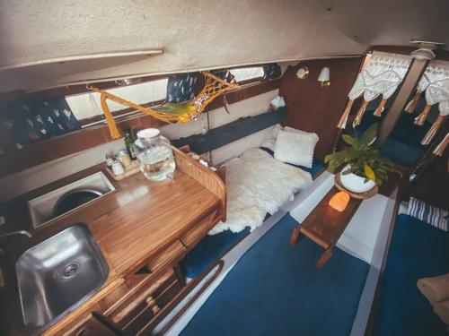 an overhead view of a kitchen and a table in a boat at Lady Blue Yacht in Nida in Nida