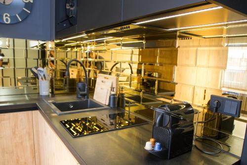 Kuchyň nebo kuchyňský kout v ubytování Apartament NEPTUN Centrum