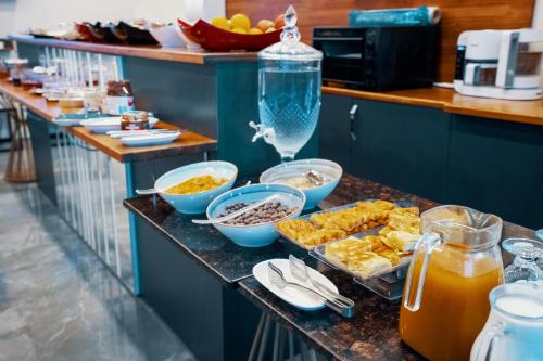 a buffet with food and drinks on a counter at Roof 264 Hotel & Suites in Sakarya