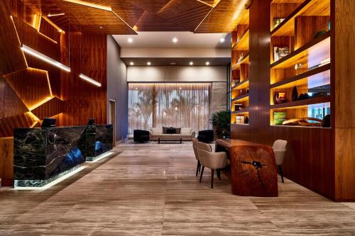 a lobby with a table and a couch at Sheraton Santos Hotel in Santos