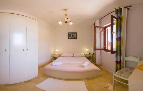 a bedroom with a large bed in a room at Apartment s Jukica in Vis