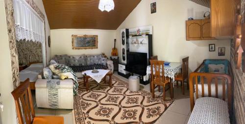 a living room with a couch and a table at Kasaj Villa in Gjirokastër