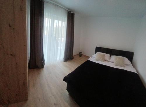 Postel nebo postele na pokoji v ubytování Apartmány Domaša Poľany