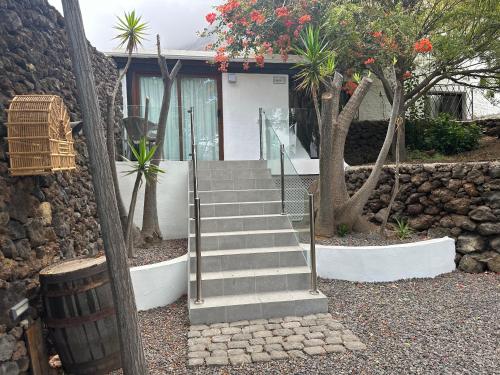 a set of stairs in front of a house at Apartamentos Finca Wapa in Frontera