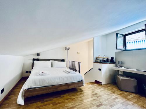 a bedroom with a large bed and a window at Eterea Charming Suites in Sorrento