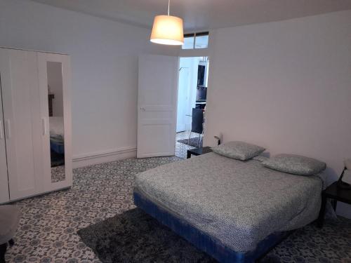 Ένα ή περισσότερα κρεβάτια σε δωμάτιο στο Appartement Cosy et Lumineux