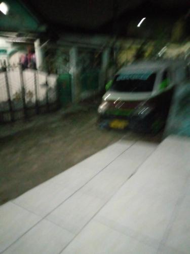 a car is parked in a parking garage at Kontrakan 