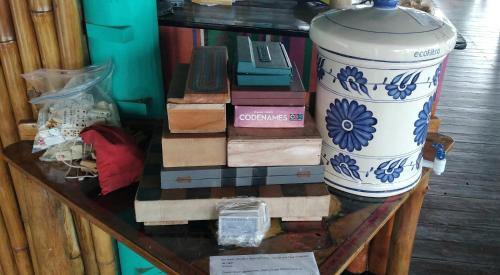 a vase sitting on top of a glass table at Tortugal Boutique River Lodge in Rio Dulce