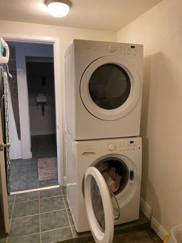 a washer and dryer in a room at Rock Ridge I. Private and close to everything. in Vero Beach