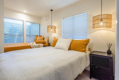 Ένα ή περισσότερα κρεβάτια σε δωμάτιο στο Beachside Apartment at Palm - Coast & Country
