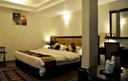 Łóżko lub łóżka w pokoju w obiekcie Hotel Mohit