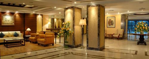 a lobby of a hotel with a couch and chairs at Fortune Park Panchwati, Kolkata - Member ITC Hotels' Group in Kolkata