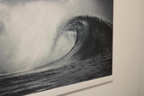 a painting of a wave in the ocean at GF Holiday Suite 3 in Varazze
