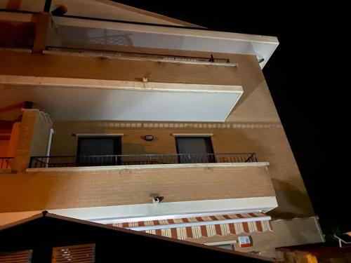 a view of a building with a balcony at Appartamento Antonietta- in Santa Maria degli Angeli