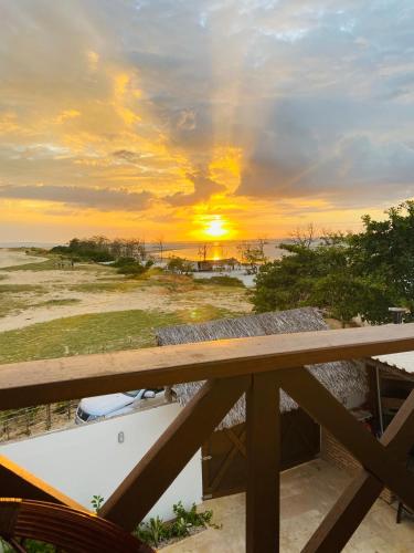 a sunset from the balcony of a house at Potxi & Cabana in Guriú