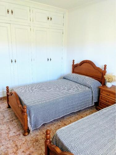 Кровать или кровати в номере Preciosa Casa de Campo + Playa + Jardín + Mascotas