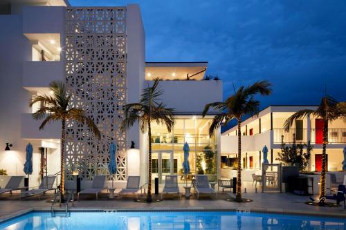 a hotel with a swimming pool in front of a building at Courtyard by Marriott Santa Barbara Downtown in Santa Barbara