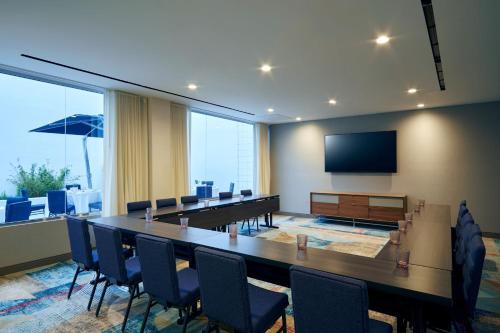 a conference room with a large table and chairs at Courtyard by Marriott Santa Barbara Downtown in Santa Barbara