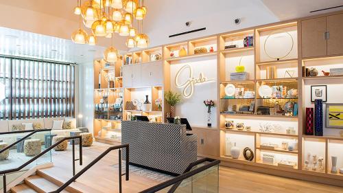 a shop with a chandelier and shelves of vases at The Cromwell, A Caesars Destination in Las Vegas