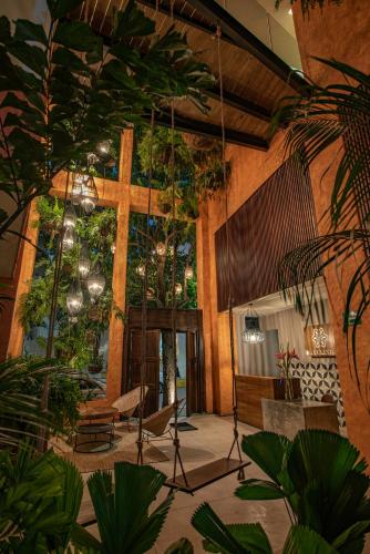 a large room with a cross and a wooden crossurrection at Sayulinda Hotel in Sayulita