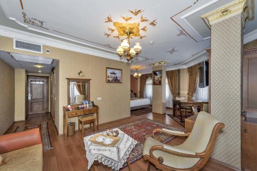 
a living room filled with furniture and a large window at Seven Hills Hotel - Special Category in Istanbul
