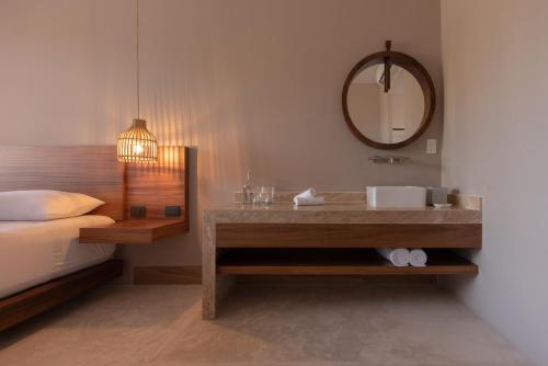 a bathroom with a sink and a mirror at Sayulinda Hotel in Sayulita