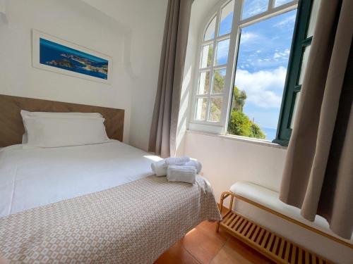 Letto o letti in una camera di Villa Bina Sea Hotel